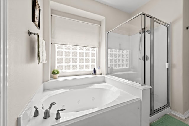 bathroom with separate shower and tub