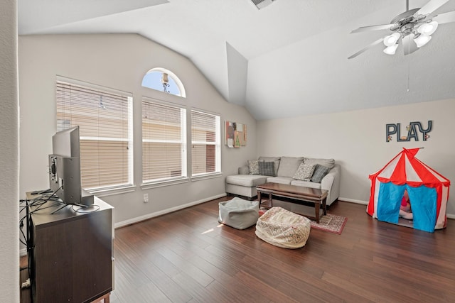 living room with ceiling fan, dark hardwood / wood-style flooring, and vaulted ceiling