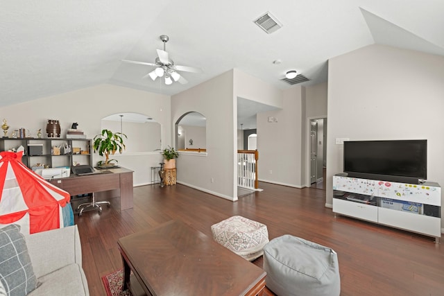 living room featuring ceiling fan, dark hardwood / wood-style flooring, and vaulted ceiling