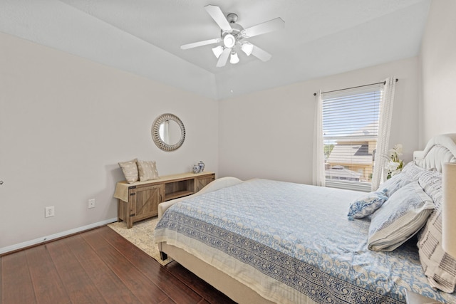 bedroom featuring ceiling fan and dark hardwood / wood-style floors