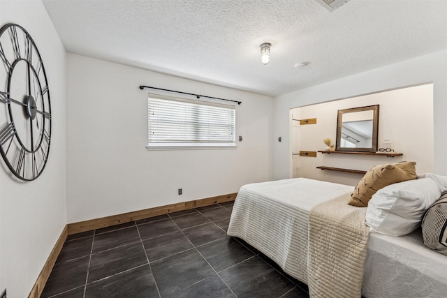 bedroom featuring a textured ceiling