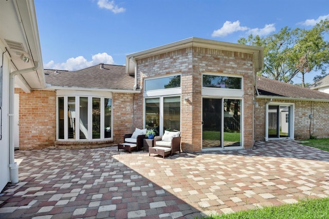 rear view of property with a patio area