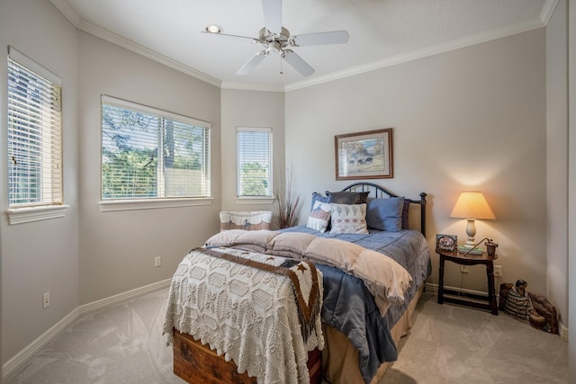 bedroom with ceiling fan, light colored carpet, and multiple windows