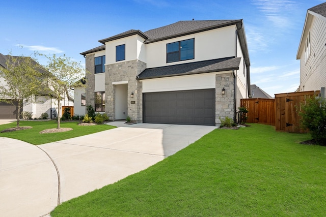 view of front of property featuring a garage and a front yard