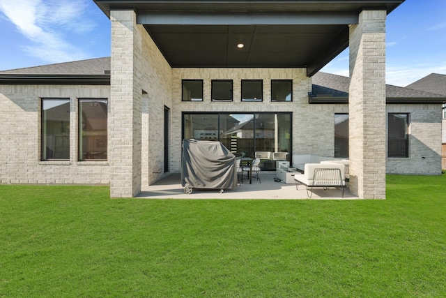 back of house with a yard, an outdoor hangout area, and a patio area