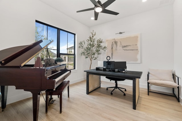 office featuring light hardwood / wood-style flooring and ceiling fan