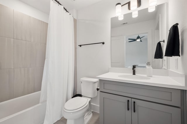 full bathroom with vanity, toilet, ceiling fan, and shower / tub combo with curtain