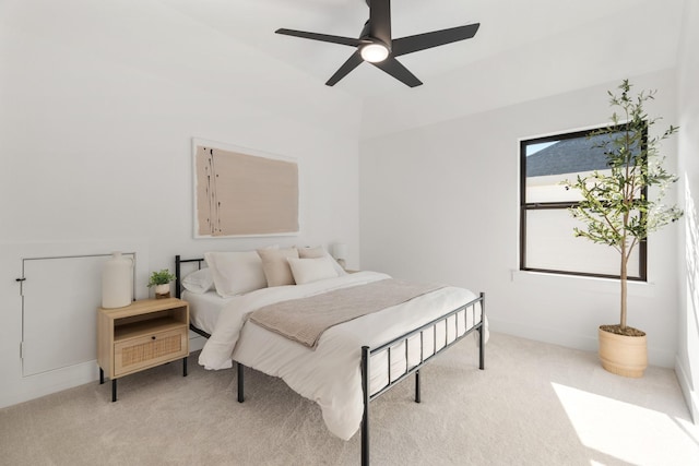 bedroom featuring ceiling fan and light colored carpet