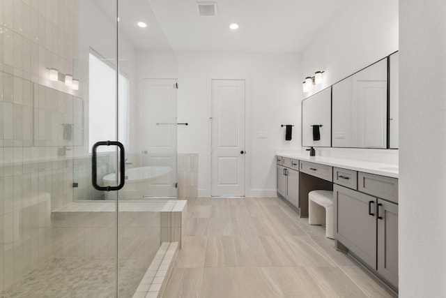 bathroom featuring vanity and a shower with door