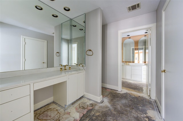 bathroom with vanity and concrete floors