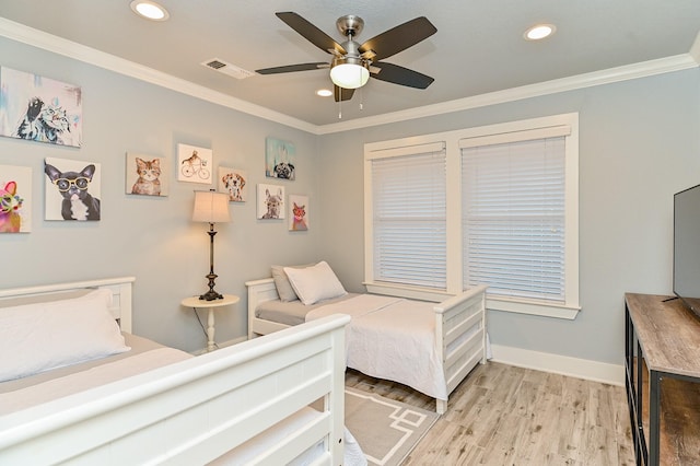 bedroom with ceiling fan, crown molding, and light hardwood / wood-style flooring