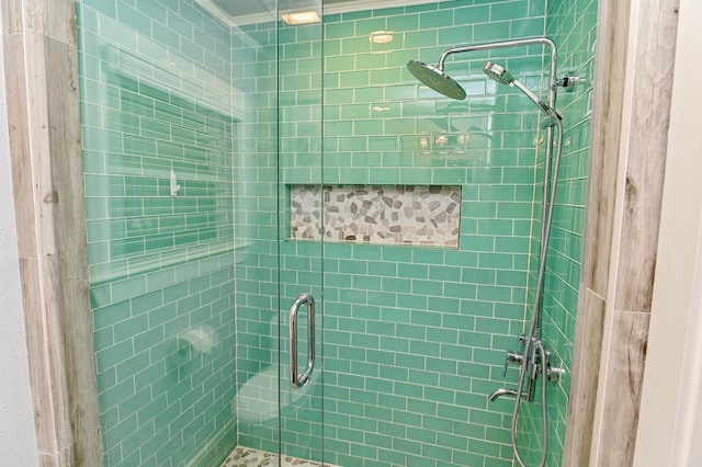 bathroom with an enclosed shower and ornamental molding