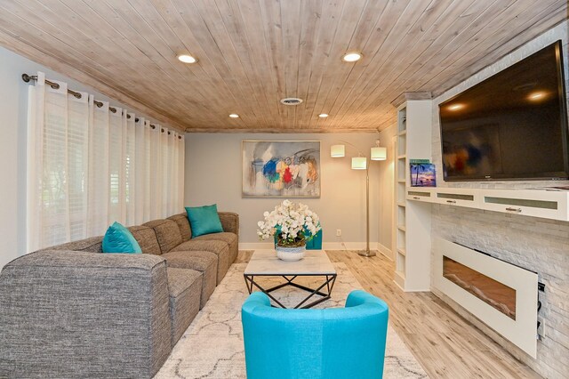 living room featuring built in shelves, light hardwood / wood-style flooring, wooden ceiling, and ornamental molding