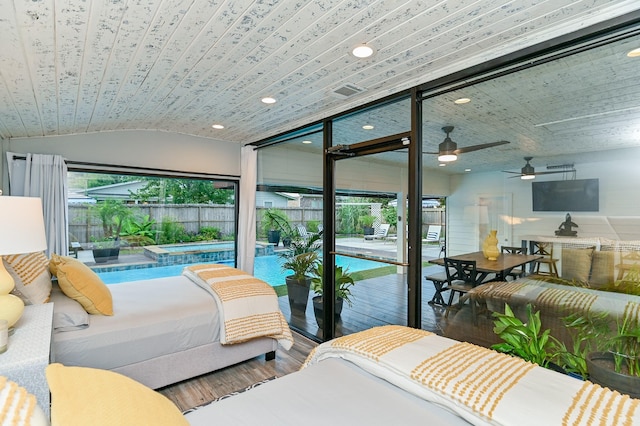 bedroom featuring hardwood / wood-style floors, access to outside, multiple windows, and wood ceiling