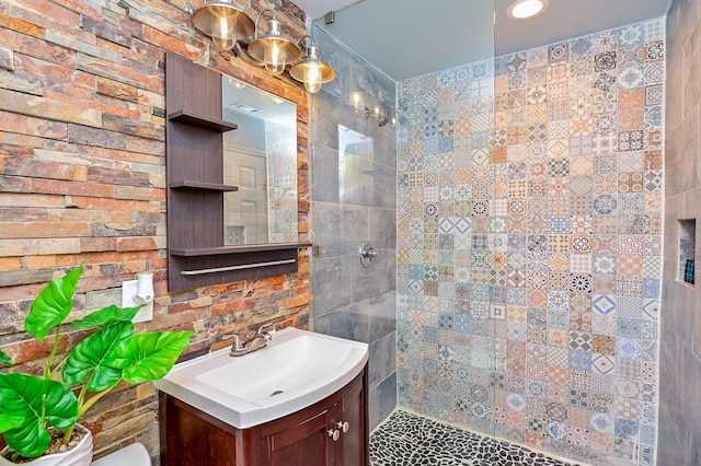 bathroom with vanity and a shower