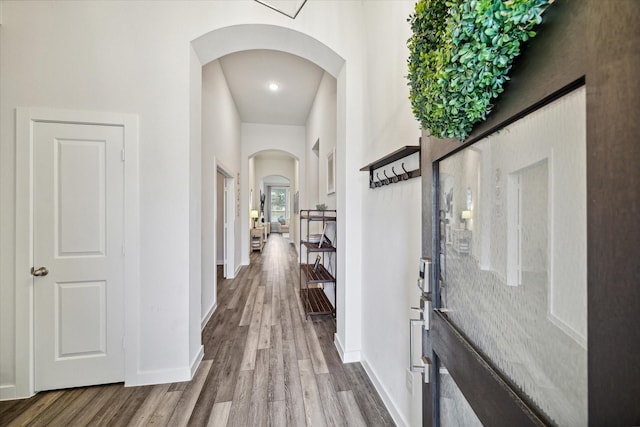 hall with wood-type flooring