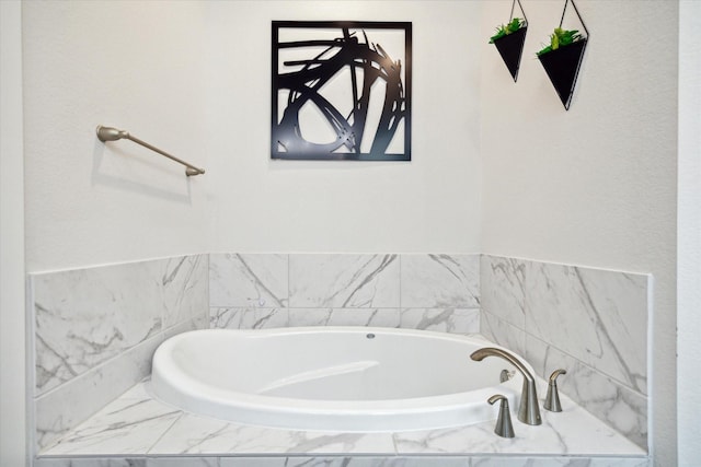 bathroom featuring tiled bath