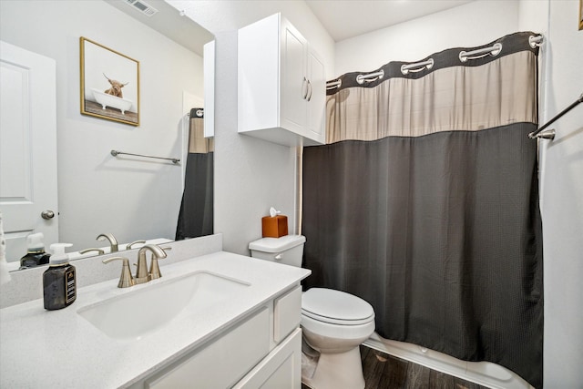 bathroom with a shower with curtain, vanity, toilet, and wood-type flooring