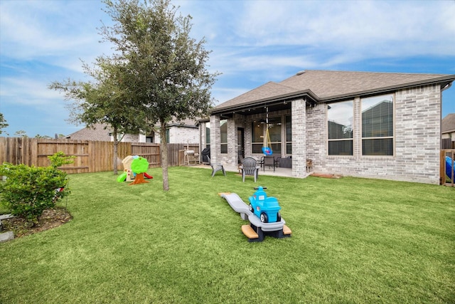 exterior space featuring a yard and a patio area