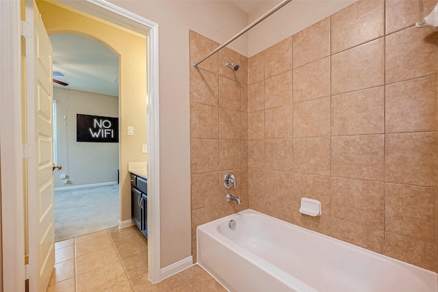 bathroom featuring tile patterned floors, vanity, and tiled shower / bath combo