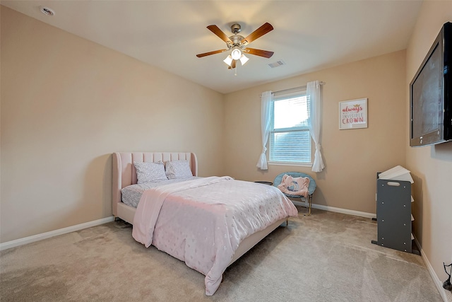 bedroom featuring ceiling fan and light carpet