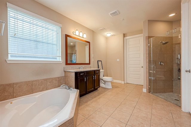 full bathroom with toilet, vanity, tile patterned floors, and independent shower and bath