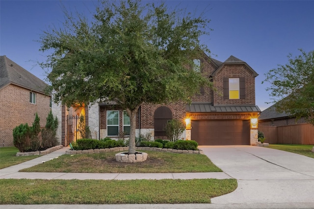 view of front of property with a garage