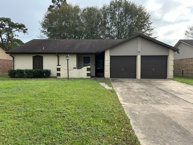 single story home featuring a front lawn and a garage