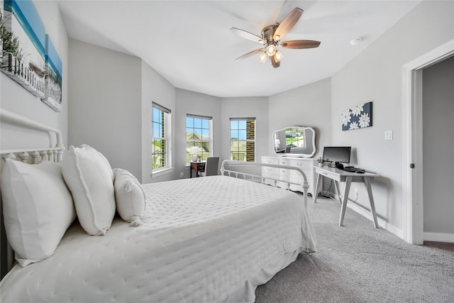 bedroom with ceiling fan and light colored carpet