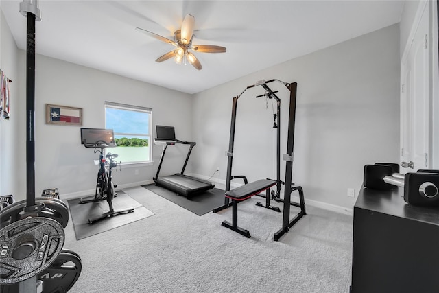 exercise area with light carpet and ceiling fan