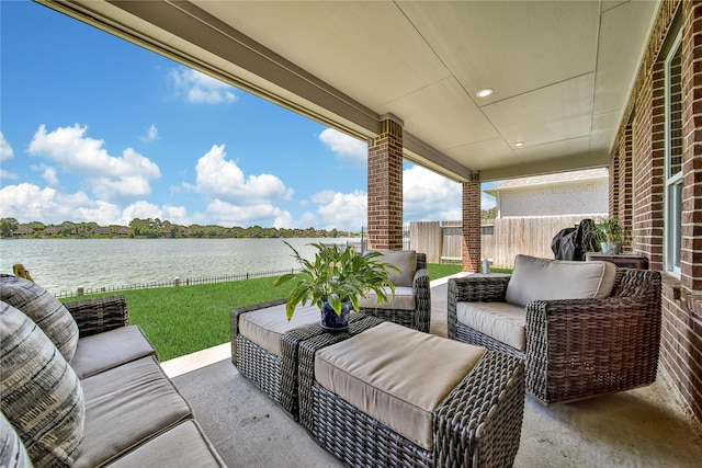 view of patio / terrace with a water view and an outdoor hangout area