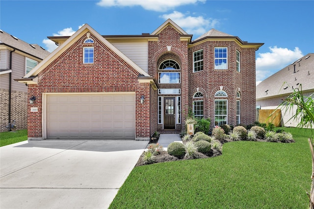 view of property with a front lawn and a garage