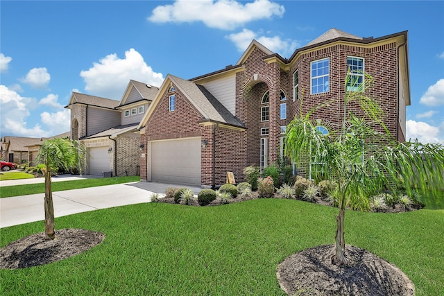 view of front of house with a front yard and a garage