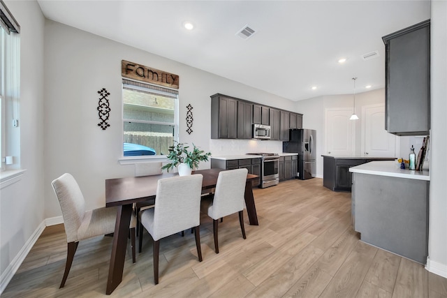 dining area featuring light wood-type flooring