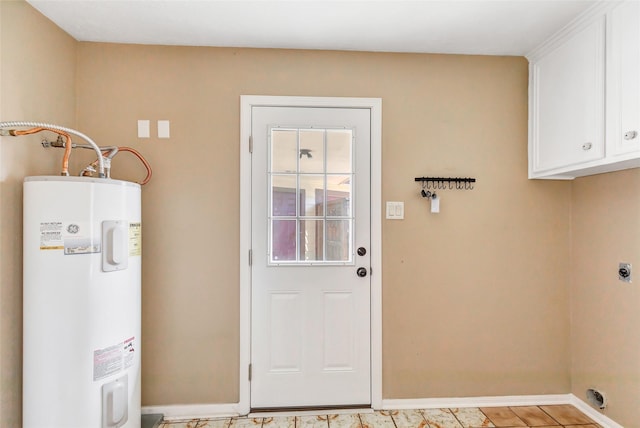 washroom featuring electric dryer hookup, cabinets, and electric water heater