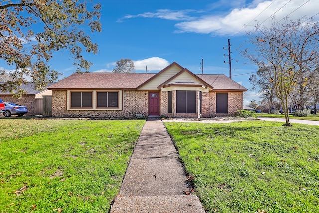 ranch-style home with a front yard