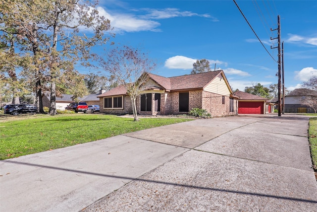 ranch-style home featuring a front lawn and a garage