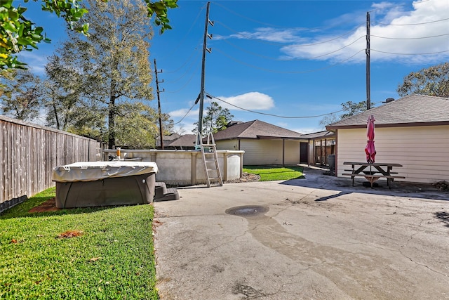 view of yard with a swimming pool and a patio