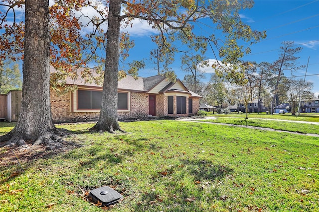 ranch-style house with a front lawn