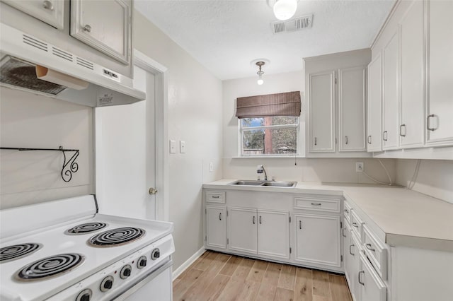 kitchen featuring white cabinetry, sink, a textured ceiling, and white electric range