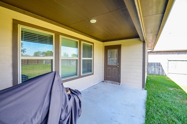 entrance to property with a patio