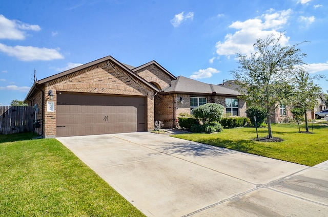 ranch-style home with a garage and a front lawn