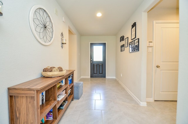 entryway with light tile patterned floors