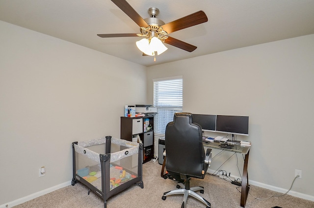 home office featuring ceiling fan and light colored carpet