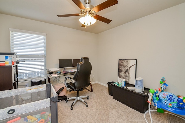 carpeted home office with ceiling fan