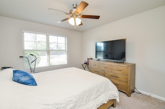 bedroom featuring ceiling fan and light colored carpet