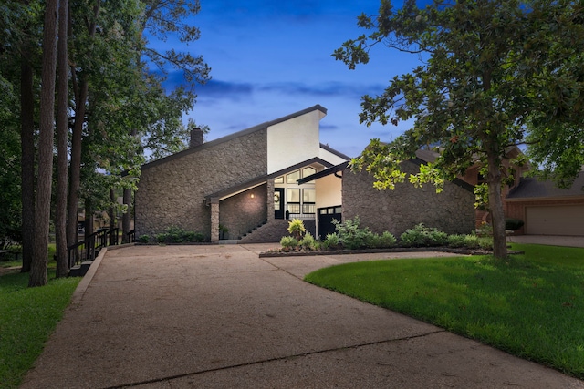 view of front of home with a lawn