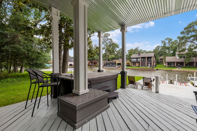 wooden deck with a lawn