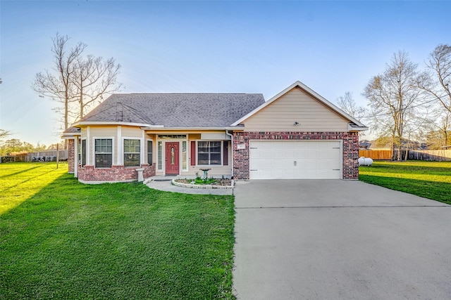 view of front of house featuring a garage and a front lawn