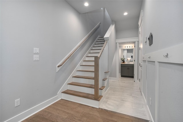 stairway featuring hardwood / wood-style floors